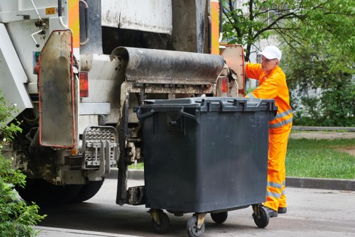 Investigation team reviewing skip hire records and evidence